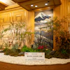 a room with a sign and plants