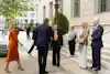 a group of people standing outside a building