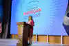 a woman standing at a podium