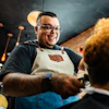 Barber cutting the customer's hair at a barber shop