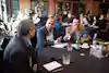 a group of people sitting at a table