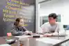 a man and a girl sitting at a table