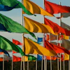 a group of flags on poles