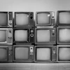 a group of old televisions
