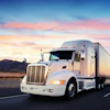 a white semi truck on the road
