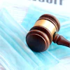 a gavel on a medical mask
