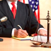 a judge writing on a book