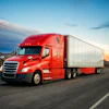 a red semi truck on the road