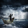 a man standing on a paper boat in the water