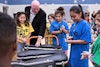 Musicnotes Chairman Tim Reiland helps students unpack new instruments