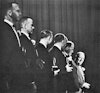 The seven original American astronauts, Gordon Cooper, John Glenn, Gus Grissom, Alan Shepard, Scott Carpenter, Wally Schirra, and Deke Slayton, receive the âGreat Living American Awardâ at the U.S. Chamber in 1962.