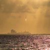 A rocket taking off from Cape Canaveral, FL.