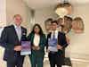 Ellington Arnold (left), Varnee Murugan (center), and Suyash Gupta (right), showcase key publications on driving access to health products and regulatory harmonization on the sidelines of WHA78.