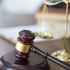 a gavel on a wooden stand