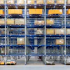 a large warehouse with boxes on shelves