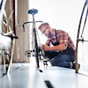 a man working on a bicycle