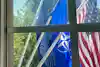 a group of flags outside a window