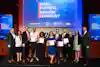 a group of people holding certificates