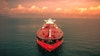 Red oil tanker in the ocean.