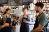 Workers talking in a coffee shop