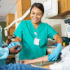 a nurse taking a blood sample of a patient