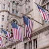 a group of flags on a building